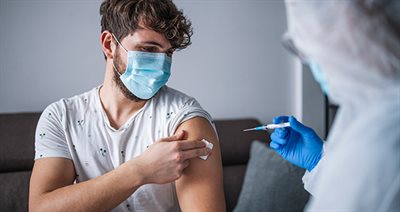 COVID-young-lad-getting-vaccine