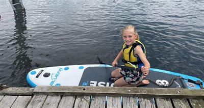 Child paddleboarding at Pier 52