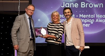 Cllr Jeremy Pert presenting award to Jane Brown at Dignity in Care Awards 2024 NR