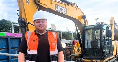 Guy Jones, Recycling Operative at Cannock Recycling Centre next to JCB NR