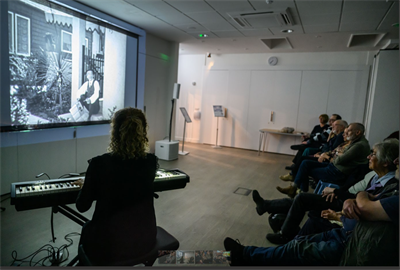 PFF Audience with Meg Morley playing piano, photo by Katja Ogrin