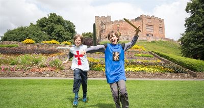 Tamworth Castle boys dressed up playing in castle grounds ©EnjoyStaffordshire Resized