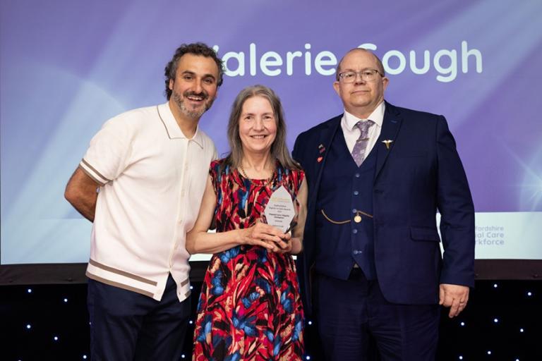 Martin Rogerson presenting the Unpaid Carer award to Valerie G small