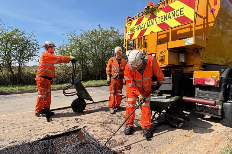 Highways crew fixing a pothole