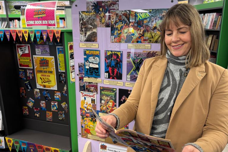 Hayley Coles with comic book at exhibition