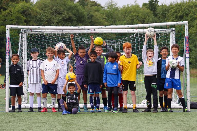 children playing football