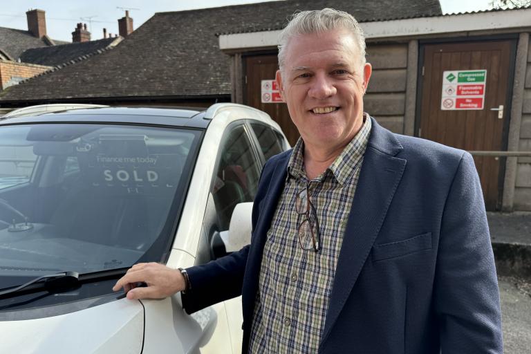 Tony Screen with car with sold sign