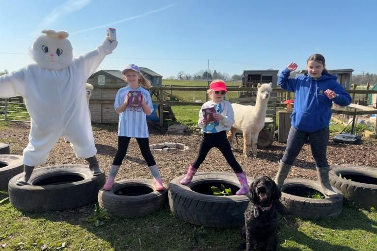 easter at farm with children and easter bunn