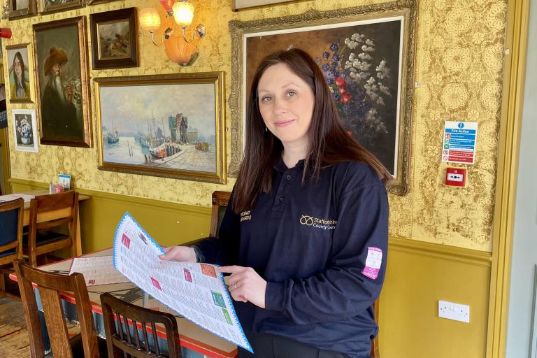 Trading Standards officer with food menu