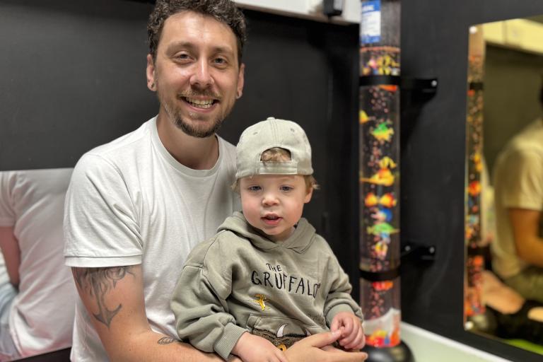 Dad Phil with child in a Family Hub