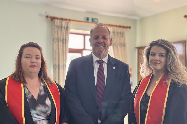 Robin Hall with apprenticeship graduates