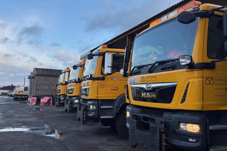 A row of bright yellow gritters