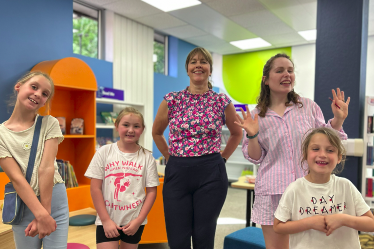 Hayley Coles with children inside Tamworth Library