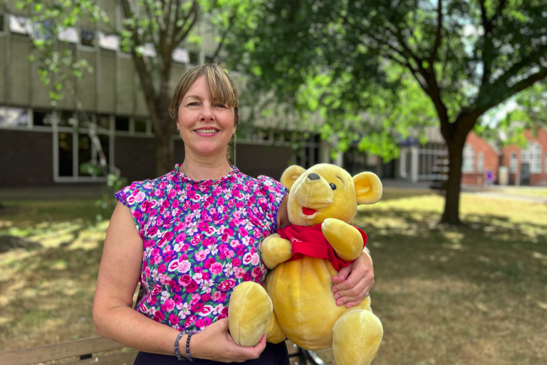 Hayley Coles holding Winnie the Pooh toy outside Tamworth Library