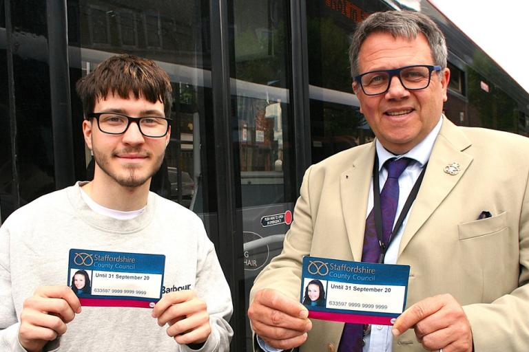 Care leaver Owen with Andrew Mynors holding bus passes