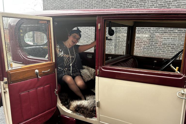History centre's Lizzie Short posing in Rolls Royce wearing 1920s fashion