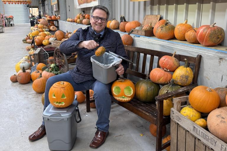Andrew Mynors with pumpkins and food waste caddy