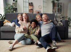 Image of a family sitting together in a living room