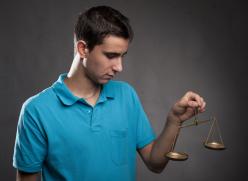 Boy holding a justice scale