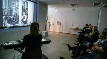 PFF Audience with Meg Morley playing piano, photo by Katja Ogrin