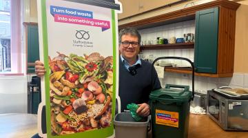 Councillor Mynors with food caddies