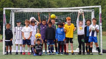 children playing football