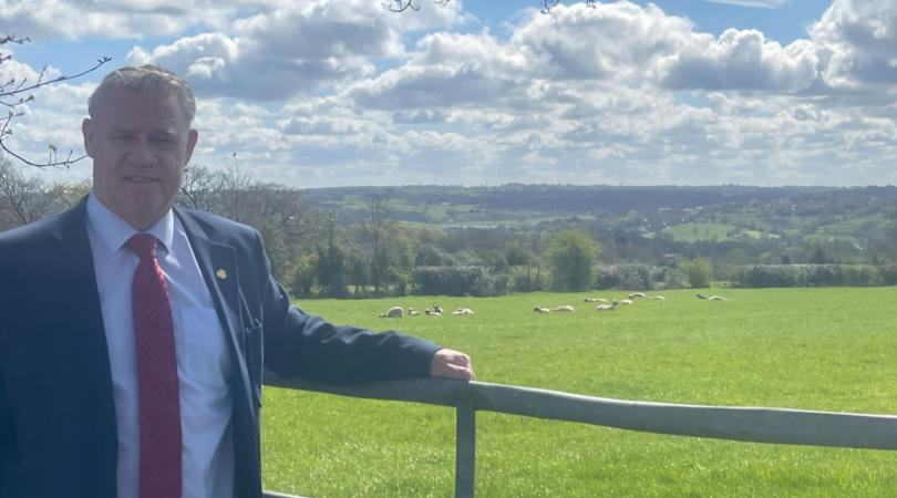 Anthony Screen by a field with livestock