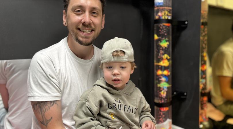 Dad Phil with child in a Family Hub