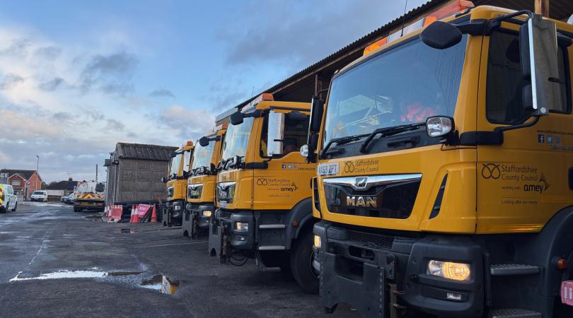 A row of bright yellow gritters