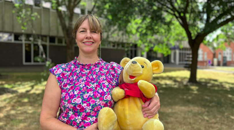 Hayley Coles holding Winnie the Pooh toy outside Tamworth Library