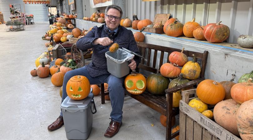 Andrew Mynors with pumpkins and food waste caddy