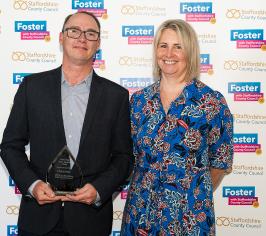 Supported lodgings host receiving his award