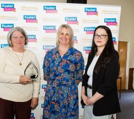 Carer and her daughter collect their award